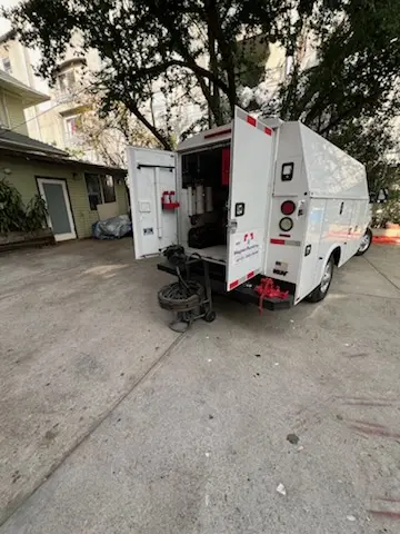 Magnet Plumbing service vehicle on-site for Grease Trap Cleaning in American Venice